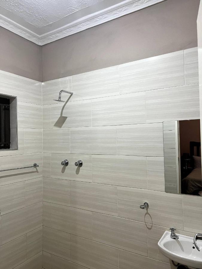 Tiled shower room at Lulu Guest Lodge
